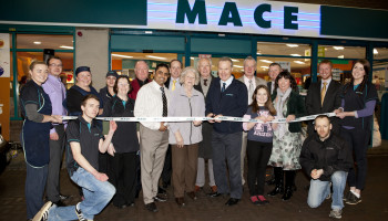 Pat and Áine Flanagan with their team celebrating the most recent revamp on the Dublin Road store in Dundalk