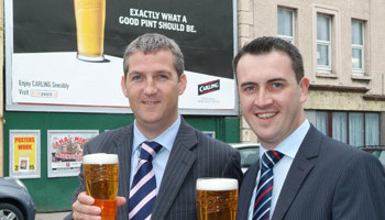 From left: On-Trade Key Account Manager Leo Brennan and Ger Corkery, Field Sales Manager for Molson Coors Ireland celebrate the new Carling Advertising Campaign in Cork City.