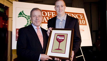 Brian Barry receives award from Kevin Behan, Edward Dillon & Company