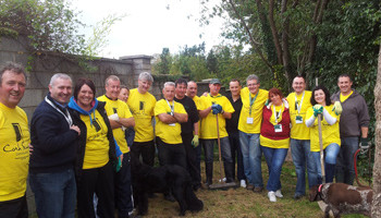 Heineken volunteers in the middle of some landscaping work at one of the Simon Community shelters in Cork.