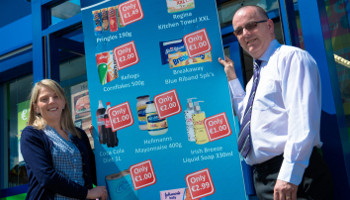 The store's general manager Lorraine Tourish and Thomas McAree, XL development manager, showcase the posters that are proving effective in drawing customers into the store