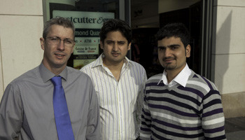 The Barry Group’s Damien Johnston, with retailers Azhar Mahmood and Haroon Nawab