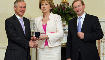 Fresh start? The new Fine Gael Minister for Enterprise Jobs and Innovation Richard Bruton receiving his seal of office from President Mary McAleese at Aras an Uachtarain as Taoiseach Enda Kenny looks on