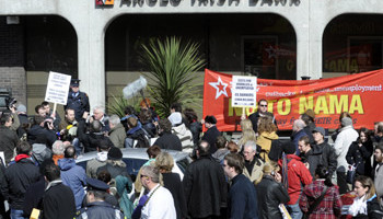 The Socialist Party hold a protest outside Anglo Irish Bank on St Stephen’s Green in Dublin on 1 April after the bank announced losses of nearly E13 billion