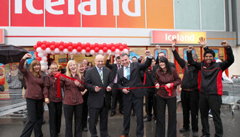 Tom Keogh, chief executive of the AIM group and Alistaire Cooke, Iceland, surrounded by staff, officially open the new Coolock Iceland store on 10 November