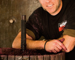 Mike Brown, wine maker at Gemtree in Australia ‘s McLaren Vale, working with a traditional basket press