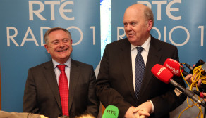 Labour Party Minister for Public Expenditure and Reform Brendan Howlin with Fine Gael Minister for Finance Michael Noonan speaking to the media after conducting the annual radio interview on the Budget on Radio 1 in RTÉ studios in Dublin on budget day