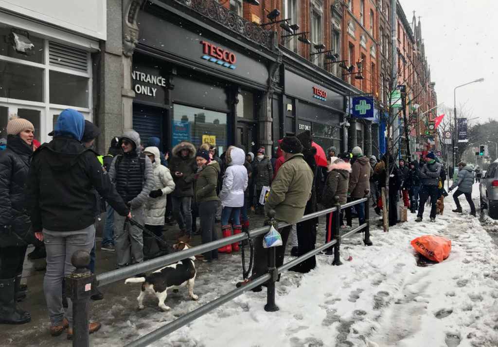 A queue of people waiting to get supplies outside Tesco in Ballsbridge in Dublin on Friday, 2 March